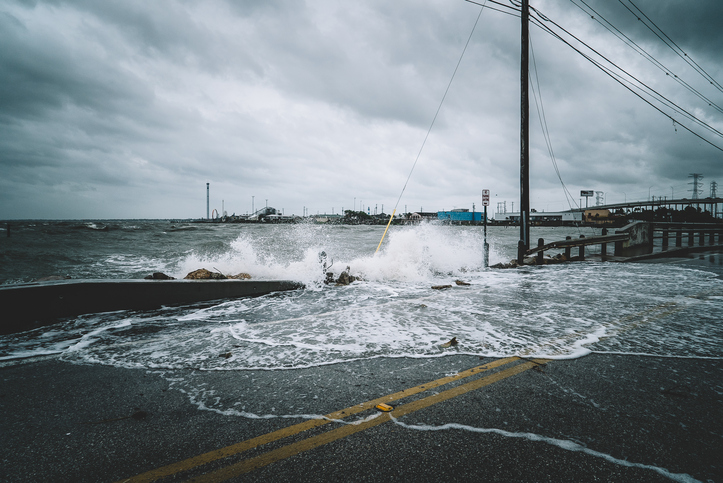 water flowing onto road from ocean during hurricane season