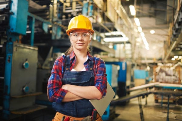 personal protective equipment on woman machine worker